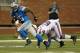DETROIT, MI - AUGUST 30: Mikel Leshoure #25 of the Detroit Lions gets around the tackle of Arthur Moats #52 of the Buffalo Bills after a first quarter catch during a pre season game at Ford Field on August 30, 2012 in Detroit, Michigan. (Photo by Gregory Shamus/Getty Images)