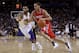 OAKLAND, CA - DECEMBER 20: Kevin Martin #12 of the Houston Rockets dribbles past Acie Law #2 of the Golden State Warriors at Oracle Arena on December 20, 2010 in Oakland, California. NOTE TO USER: User expressly acknowledges and agrees that, by downloading and or using this photograph, User is consenting to the terms and conditions of the Getty Images License Agreement. (Photo by Ezra Shaw/Getty Images)