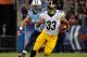 NASHVILLE, TN - OCTOBER 11: Isaac Redman #33 of the Pittsburgh Steelers rushes past Colin McCarthy #52 of the Tennessee Titans at LP Field on October 11, 2012 in Nashville, Tennessee. (Photo by Frederick Breedon/Getty Images)