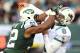 EAST RUTHERFORD, NJ - OCTOBER 28: Marcus Dowtin #92 of the New York Jets is called for roughing the passer as he collides with Matt Moore #8 of the Miami Dolphins on October 28, 2012 at MetLife Stadium in East Rutherford, New Jersey.The Miami Dolphins defeated the New York Jets 30-9. (Photo by Elsa/Getty Images)