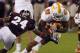 STARKVILLE, MS - OCTOBER 13: Running back Rajion Neal #20 of the Tennessee Volunteers carries the ball and tries to get around defensive back Jamerson Love #24 of the Mississippi State Bulldogs on October 13, 2012 at Davis Wade Stadium in Starkville, Mississippi. (Photo by Butch Dill/Getty Images)
