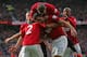 Manchester United players celebrate the opener against Arsenal