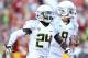 LOS ANGELES, CA - NOVEMBER 03: Running back Kenjon Barner #24 and quarterback Marcus Mariota #8 of the Oregon Ducks celebrate after a 27 yard touchdown run by Barner in the second quarter against the USC Trojans at the Los Angeles Memorial Coliseum on November 3, 2012 in Los Angeles, California. (Photo by Stephen Dunn/Getty Images)