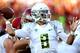 LOS ANGELES, CA - NOVEMBER 03: Quarterback Marcs Mariota #8 of the Oregon Ducks throws a pass against the USC Trojans at the Los Angeles Memorial Coliseum on November 3, 2012 in Los Angeles, California. (Photo by Stephen Dunn/Getty Images)