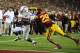 LOS ANGELES, CA - NOVEMBER 03: Kenjon Barner #24 of the Oregon Ducks runs away from Jawanza Sterling #29 of the USC Trojans at Los Angeles Memorial Coliseum on November 3, 2012 in Los Angeles, California. (Photo by Robert Laberge/Getty Images)
