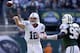EAST RUTHERFORD, NJ - OCTOBER 14: Andrew Luck #12 of the Indianapolis Colts passes under pressure from Muhammad Wilkerson #96 the New York Jets at MetLife Stadium on October 14, 2012 in East Rutherford, New Jersey. (Photo by Nick Laham/Getty Images)