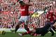 MANCHESTER, ENGLAND - NOVEMBER 03: Robin van Persie of Manchester United is challenged by Lukas Podolski of Arsenal during the Barclays Premier League match between Manchester United and Arsenal at Old Trafford on November 3, 2012 in Manchester, England. (Photo by Alex Livesey/Getty Images)
