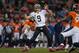 DENVER, CO - OCTOBER 28: Quarterback Drew Brees #9 of the New Orleans Saints passes as free safety Jim Leonhard #36 of the Denver Broncos pressures during a game at Sports Authority Field Field at Mile High on October 28, 2012 in Denver, Colorado. (Photo by Dustin Bradford/Getty Images)