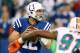 INDIANAPOLIS, IN - NOVEMBER 04: Andrew Luck #12 of the Indianapolis Colts gets ready to throw a first quarter pass while being rushed by Cameron Wake #91 of the Miami Dolphins at Lucas Oil Stadium on November 4, 2012 in Indianapolis, Indiana. (Photo by Gregory Shamus/Getty Images)