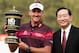 SHENZHEN, CHINA - NOVEMBER 04: Ian Poulter of England poses with the trophy beside HSBC's Peter Wong (R) after winning the WGC HSBC Champions during the final round at the Mission Hills Resort on November 4, 2012 in Shenzhen, China. (Photo by Andrew Redington/Getty Images)