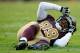 LANDOVER, MD - NOVEMBER 04: Santana Moss #89 of the Washington Redskins lies on the ground after a play in second half of a game against the Carolina Panthers at FedExField on November 4, 2012 in Landover, Maryland. (Photo by Patrick McDermott/Getty Images)