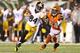 CINCINNATI, OH - OCTOBER 21: Antonio Brown #84 of the Pittsburgh Steelers runs with the ball while defended by Adam Jones #24 of the Cincinnati Bengals during the NFL game at Paul Brown Stadium on October 21, 2012 in Cincinnati, Ohio. (Photo by Andy Lyons/Getty Images)