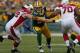 GREEN BAY, WI - NOVEMBER 04: Clay Matthews #52 of the Green Bay Packers rushes between Rich Ohrnberger #72 (L) and Bobby Massie #70 of the Arizona Cardinals at Lambeau Field on November 4, 2012 in Green Bay, Wisconsin. The Packers defeated the Cardinals 31-17. (Photo by Jonathan Daniel/Getty Images)