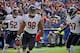 NASHVILLE, TN - NOVEMBER 04: Corey Wootton #98 of the Chicago Bears celebrates scoring a touchdown on a blocked punt with teammates Blake Costanzo #52 and J.T. Thomas #97 at LP Field on November 4, 2012 in Nashville, Tennessee. (Photo by Frederick Breedon/Getty Images)