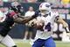 HOUSTON, TX- NOVEMBER 04: Buffalo Bills quarterback Ryan Fitzpatrick #14 is chased by Houston Texans linebacker Whitney Mercilus #59 on November 4, 2012 at Reliant Stadium in Houston, Texas. There was no penalty on the play. Texans won 21 to 9.(Photo by Thomas B. Shea/Getty Images)
