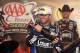 FORT WORTH, TX - NOVEMBER 04: Jimmie Johnson, driver of the #48 Lowe's Chevrolet, celebrates with champagne in Victory Lane after winning the NASCAR Sprint Cup Series AAA Texas 500 at Texas Motor Speedway on November 4, 2012 in Fort Worth, Texas. (Photo by Tom Pennington/Getty Images)