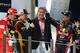 ABU DHABI, UNITED ARAB EMIRATES - NOVEMBER 04: Race winner Kimi Raikkonen (2nd left) of Finland and Lotus talks on the podium to former driver David Coulthard (2nd right) alongside second placed Fernando Alonso (left) of Spain and Ferrari, third placed Sebastian Vettel (right) of Germany and Red Bull Racing following the Abu Dhabi Formula One Grand Prix at the Yas Marina Circuit on November 4, 2012 in Abu Dhabi, United Arab Emirates. (Photo by Paul Gilham/Getty Images)