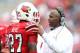 LOUISVILLE, KY - NOVEMBER 03: Charlie Strong the head coach of the Louisville Cardinals talks with Jermaine Reve #27 during the game against the Temple Owls at Papa John's Cardinal Stadium on November 3, 2012 in Louisville, Kentucky. (Photo by Andy Lyons/Getty Images)