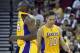Oct 7, 2012; Fresno, CA, USA; Los Angeles Lakers guard Steve Nash (10) walks past guard Kobe Bryant (24) during a break in the action against the Golden State Warriors in the second quarter at the Save Mart Center. The Warriors defeated the Lakers 110-83. Mandatory Credit: Cary Edmondson-US PRESSWIRE