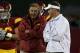 LOS ANGELES, CA - SEPTEMBER 11: Head coach Lane Kiffin (R) and his father and defensive coordinator Monte Kiffin of the USC Trojans talk during warmups for their game with the Virginia Cavaliers at Los Angeles Memorial Coliseum on September 11, 2010 in Los Angeles, California. (Photo by Stephen Dunn/Getty Images)