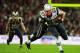 LONDON, ENGLAND - OCTOBER 28: Rob Gronkowski #87 of the New England Patriots is tackled by Quintin Mikell #27 of the St. Louis Rams during the NFL International Series match between the New England Patriots and the St. Louis Rams at Wembley Stadium on October 28, 2012 in London, England. (Photo by Jamie McDonald/Getty Images)