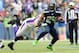 Nov 4, 2012; Seattle, WA, USA; Seattle Seahawks running back Marshawn Lynch (24) fights off Minnesota Vikings defensive end Jared Allen (69) while carrying the ball during the 2nd half at CenturyLink Field. Seattle defeated Minnesota 30-20. Mandatory Credit: Steven Bisig-US PRESSWIRE