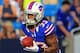 Aug 25, 2012; Orchard Park, NY, USA; Buffalo Bills cornerback Ron Brooks (33) runs with the ball during pre-game warm-ups at Ralph Wilson Stadium. Mandatory Credit: Kevin Hoffman-US PRESSWIRE