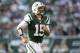 EAST RUTHERFORD, NJ - OCTOBER 14: Tim Tebow #15 of the New York Jets runs from the field against the Indianapolis Colts at MetLife Stadium on October 14, 2012 in East Rutherford, New Jersey. (Photo by Nick Laham/Getty Images)