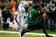 EUGENE, OR - OCTOBER 06: DeAnthoy Thomas #5 of the Oregon Ducks catches a pass against Josh Hill #23 of the California Golden Bears to score a touchdown on October 6, 2011 at the Autzen Stadium in Eugene, Oregon. (Photo by Jonathan Ferrey/Getty Images)