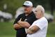 Aug 04, 2011; Bethlehem, PA, USA; Philadelphia Eagles head coach Andy Reid (L) talks with Eagles chairman and CEO Jeffrey Lurie (R) during training camp at Lehigh University. Mandatory Credit: Howard Smith-US PRESSWIRE