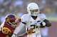 LOS ANGELES, CA - NOVEMBER 03: Kenjon Barner #24 of the Oregon Ducks runs away from Gerald Bowman #27 of the USC Trojans at Los Angeles Memorial Coliseum on November 3, 2012 in Los Angeles, California. (Photo by Robert Laberge/Getty Images)