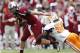 COLUMBIA, SC - OCTOBER 27: Connor Shaw #14 of the South Carolina Gamecocks tries to avoid Curt Maggitt #56 of the Tennessee Volunteers during the game at Williams-Brice Stadium on October 27, 2012 in Columbia, South Carolina. South Carolina won 38-35. (Photo by Joe Robbins/Getty Images)