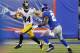 Nov 4, 2012; East Rutherford, NJ, USA; Pittsburgh Steelers wide receiver Antonio Brown (84) turns up field after reception against New York Giants strong safety Stevie Brown (27) during the first half at MetLife Stadium. Mandatory Credit: Jim O'Connor-US PRESSWIRE