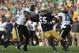 SOUTH BEND, IN - SEPTEMBER 08: Prince Shembo #55 of the Notre Dame Fighting Irish rushes past Gabe Holmes #86 of the Purdue Boilermakers at Notre Dame Stadium on September 8, 2012 in South Bend, Indiana. Notre Dame defeated Purdue 21-17. (Photo by Jonathan Daniel/Getty Images)