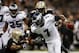 NEW ORLEANS, LA - NOVEMBER 05: Michael Vick #7 of the Philadelphia Eagles avoids a tackle by Will Smith #91 of the New Orleans Saints at Mercedes-Benz Superdome on November 5, 2012 in New Orleans, Louisiana. (Photo by Chris Graythen/Getty Images)