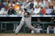 DENVER, CO - JUNE 30: Yasmani Grandal #12 of the San Diego Padres hits his second home run of the game in the sixth inning of a game against the Colorado Rockies at Coors Field on June 30, 2012 in Denver, Colorado. (Photo by Dustin Bradford/Getty Images)