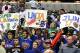 Mar 17, 2012; Indianapolis, IN, USA; Fans sitting behind the New York Knicks bench hold up signs supporting Jeremy Lin during a game against the Indiana Pacers at Bankers Life Fieldhouse. New York defeated Indiana 102-88. Mandatory Credit: Brian Spurlock-US PRESSWIRE