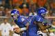 BOISE, ID - SEPTEMBER 20: Joe Southwick #16 of the Boise State Broncos fakes a handoff to D.J. Harper #7 during the game against the BYU Cougars at Bronco Stadium on September 20, 2012 in Boise, Idaho. (Photo by Otto Kitsinger III/Getty Images)