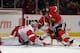 CHICAGO, IL - FEBRUARY 21: Patrick Sharp #10 of the Chicago Blackhawks is pushed into Jimmy Howard #35 of the Detroit Red Wings by Brad Stuart #23 at the United Center on February 21, 2012 in Chicago, Illinois. (Photo by Jonathan Daniel/Getty Images)