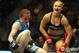 August 18, 2012; San Diego, CA, USA; Ronda Rousey (black shirt) as she defeated Sarah Kaufman (blue shirt)during their Strikeforce MMA women's bantamweight title bout at the Valley View Casino Center. Rousey won in 54 seconds of the first round. Mandatory Credit: Jayne Kamin-Oncea-US PRESSWIRE