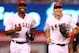 ANAHEIM, CA - AUGUST 14: Mike Trout #27 (R) and Torii Hunter #48 of the Los Angeles Angels of Anaheim laugh as they come off the field between innings in the game with the Cleveland Indians at Angel Stadium of Anaheim on August 14, 2012 in Anaheim, California. (Photo by Stephen Dunn/Getty Images)