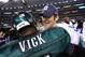 ARLINGTON, TX - DECEMBER 24: Tony Romo #9 of the Dallas Cowboys greets Michael Vick #7 of the Philadelphia Eagles after a game at Cowboys Stadium on December 24, 2011 in Arlington, Texas. Romo suffered a hand injury during the first quarter of play against the Eagles. (Photo by Ronald Martinez/Getty Images)