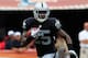 MIAMI GARDENS, FL - SEPTEMBER 16: Running back Mike Goodson #25 of the Oakland Raiders runs the ball back for a touchdown against the the Miami Dolphins at Sun Life Stadium on September 16, 2012 in Miami Gardens, Florida. (Photo by Chris Trotman/Getty Images)