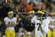 CHAMPAIGN, IL - NOVEMBER 12: Devin Gardner #7 of the Michigan Wolverines throws a touchdown pass against the Illinois Fighting Illini at Memorial Stadium on November 12, 2011 in Champaign, Illinois. Michigan defeated Illinois 31-14. (Photo by Jonathan Daniel/Getty Images)