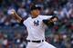 NEW YORK, NY - OCTOBER 14: Hiroki Kuroda #18 of the New York Yankees throws a pitch against the Detroit Tigers during Game Two of the American League Championship Series at Yankee Stadium on October 14, 2012 in the Bronx borough of New York City. (Photo by Alex Trautwig/Getty Images)