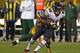 GREEN BAY, WI - SEPTEMBER 13: Earl Bennett #80 of the Chicago Bears tries to break away from Tramon Williams #38 of the Green Bay Packers at Lambeau Field on September 13, 2012 in Green Bay, Wisconsin. The Packers defeated the Bears 23-10. (Photo by Jonathan Daniel/Getty Images)