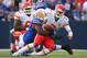 ORCHARD PARK, NY - SEPTEMBER 16: Matt Cassel #7 of the Kansas City Chiefs fumbles the ball after being tackled by Alex Carrington #92 of the Buffalo Bills in an NFL game at Ralph Wilson Stadium on September 16, 2012 in Orchard Park, New York. (Photo by Tom Szczerbowski/Getty Images)