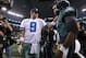 ARLINGTON, TX - DECEMBER 24: Tony Romo #9 of the Dallas Cowboys greets Michael Vick #7 of the Philadelphia Eagles after a game at Cowboys Stadium on December 24, 2011 in Arlington, Texas. Romo suffered a hand injury during the first quarter of play against the Eagles. (Photo by Ronald Martinez/Getty Images)