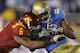 PASADENA, CA - DECEMBER 04: Malcolm Smith #6 of the USC Trojans tackles Nelson Rosario #83 of the UCLA Bruins during the first half at the Rose Bowl on December 4, 2010 in Pasadena, California. USC defeated UCLA 28-14. (Photo by Jeff Gross/Getty Images)