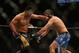 Jul. 7, 2012; Las Vegas, NV, USA; UFC fighter Cung Le (left) punches Patrick Coto during a middleweight bout in UFC 148 at the MGM Grand Garden Arena. Mandatory Credit: Mark J. Rebilas-US PRESSWIRE